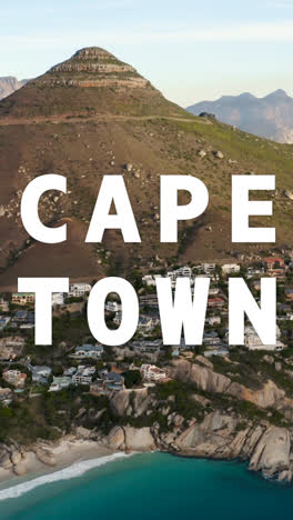 Vertical-Video-Of-Coastline-With-Ocean-And-Countryside-In-South-Africa-Overlaid-With-Animated-Graphic-Spelling-Out-Cape-Town